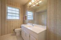 Secondary bathroom in hallway.