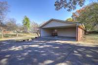 In addition to the 2 car carport you have a huge covered carport