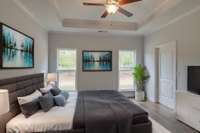 Primary bedroom, there are TWO on the main level!
**Virtually Staged Photo**