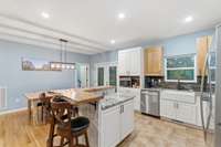 Double doors go to back deck. Utility room is left of the double doors.