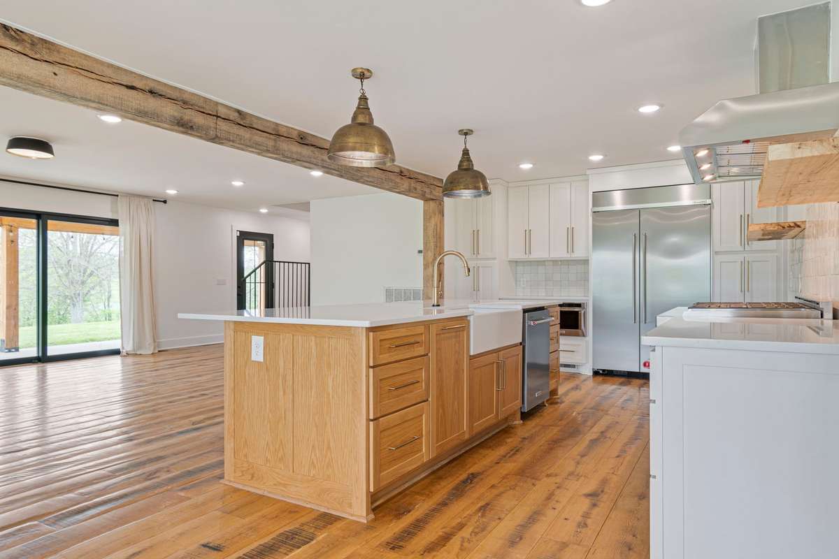 Large Kitchen Island with easy entertainment set up to living room and guest