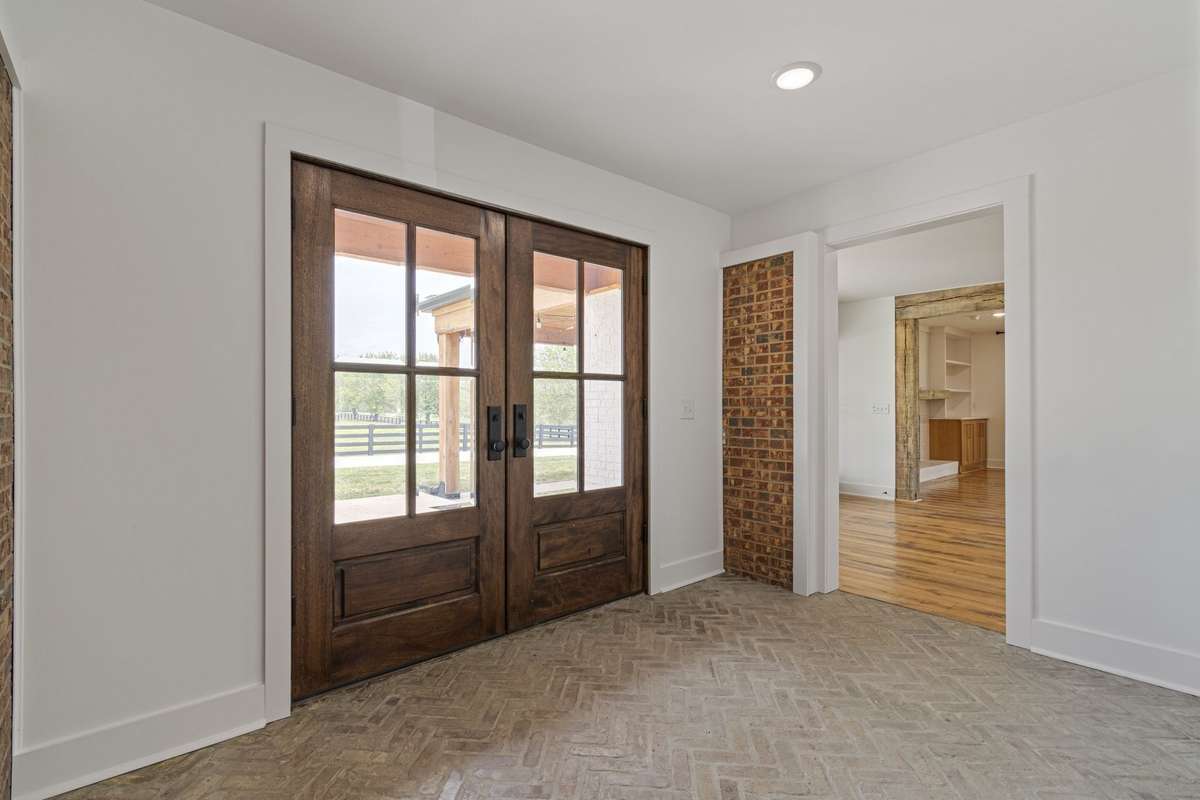 Grand Foyer with exposed mosaic brick floor