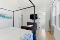 Walk-in Closet with built-ins on your left + ensuite bathroom on your right