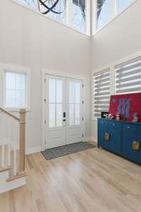 Two-Story Formal Entry is topped by more stunning windows