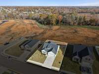 Aerial view of home with approximate property lines.