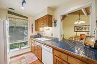 Fully functional kitchen with large pass thru to spacious dining room