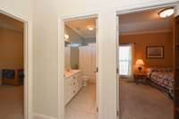 Split bedroom floor plan has secondary bedrooms and other bath on the other side of living spaces for privacy.