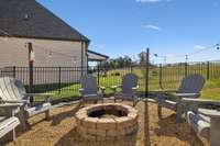 A beautiful aluminum fence surrounds the backyard, providing a safe space for little ones or four-legged family members.