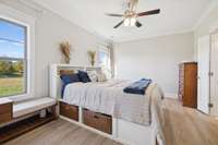 Crested with a ceiling fan and flanked by two lovely, trimmed windows, the primary bedroom offers plenty of space for all your needs.  New LVP flooring has just been installed, giving it quite the modern feel and look.