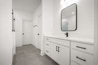 Primary Bath featuring separate sinks &  black faucets/hardware/mirrors . Actual Home