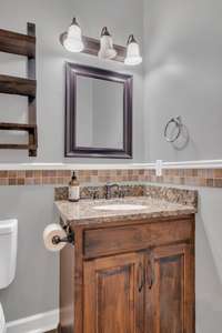 Guest Bathroom that is located just off the hallway that splits super the Guest BR and third Bedroom.  Perfect for guests to stay..............and stay out of your way!