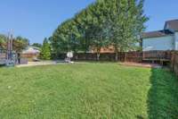 Large fully fenced backyard and it's flat, too!
