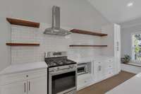 Lots of counterspace  and open shelving so that your guests can see all of your Christmas attire while you
cook on the 6 burner gas range