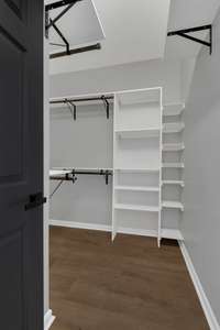 This is the large walk-in closet accessible through the Mater Bathroom