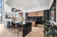 Entertainers kitchen where everyone can gather and graze!  Second island off the kitchen provides a perfect buffet when entertaining friends or a lake side puzzler's perch who needs to be near the action!