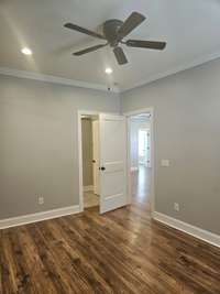 Primary bedroom with view into gathering area.