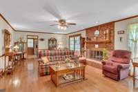 Large family room with fireplace...these are real 3/4 inch oak hardwood floors in Great room, kitchen-eat area, Dining room, entry foyer, and hall way.