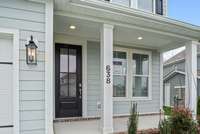 Large Front porch and upgraded 4 Lite Door