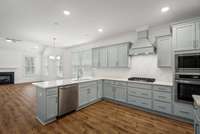 Kitchen includes QUARTZ countertops, GAS cooking, SOFT CLOSE cabinets, Pot Drawers & Gourmet Appliance Package