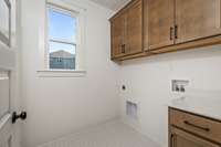 *Photos for example only* Laundry room connectivity right off the primary closet!