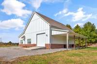 Huge pull-through garage opens from front and back - 17x41 with a 10' tall garage door entrance and 12x41 covered porch/carport