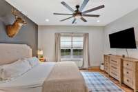 The primary suite offers a walk-in closet and a gorgeous bath with custom tile shower and double quartz vanities.