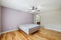 Primary bedroom with a view into the private en-suite bath.