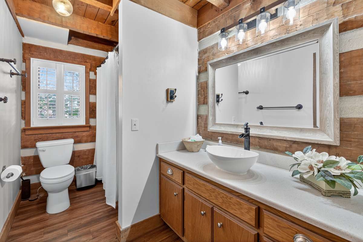 Primary Bath with New Bath/Shower Inserts and Vanities
