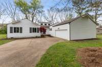 Home sits on over half an acre with a long driveway and two-car garage