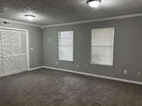 extra large rec room with lots of daylight, fresh flooring and paint