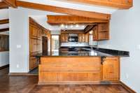 Kitchen- tile, granite countertop, range/oven, dishwasher, microwave