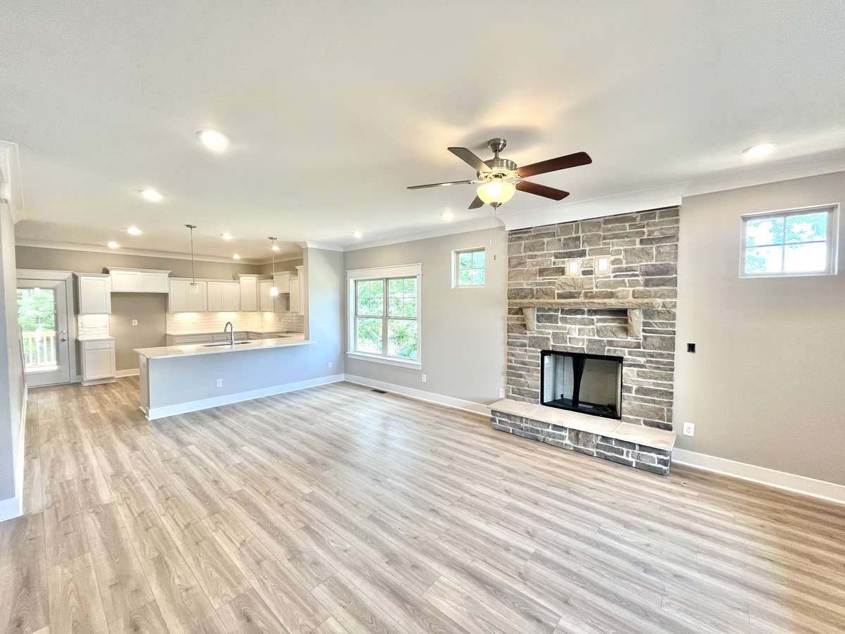 Stock photo . Your home will have fireplace with wood mantle and marble surround instead of stone.