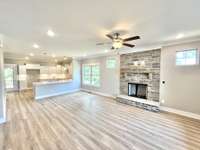 Stock photo . Your home will have fireplace with wood mantle and marble surround instead of stone.