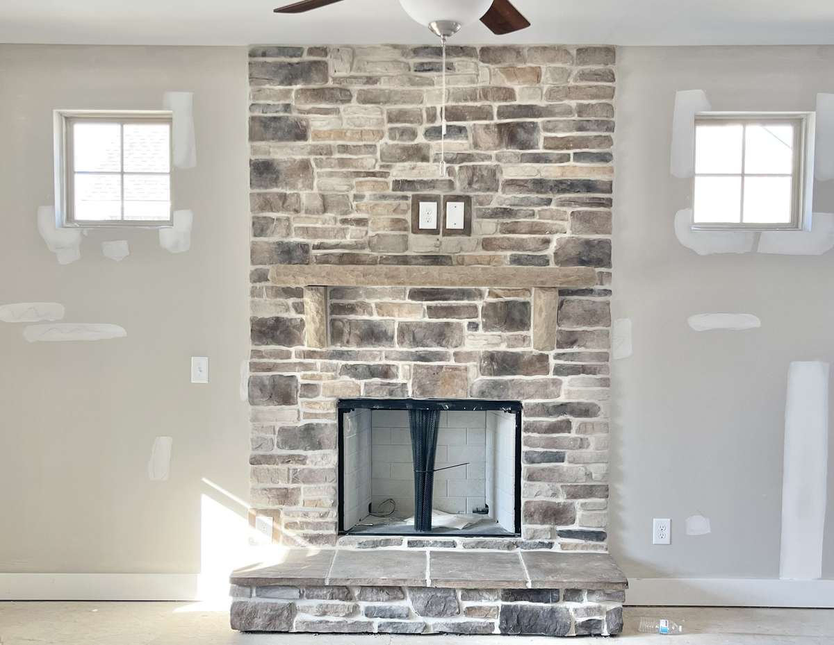 Interior fireplace matches exterior stone. This is so cozy and warm.