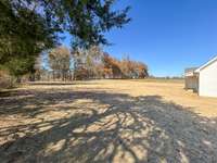 A spacious yard provides plenty of room for outdoor activities and entertaining.