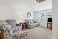 The upstairs loft area is a light-filled flexible space