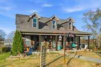 The three eye brow windows lets in tons of natural light into the home.