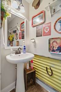 Enjoy a cute half bath close to the kitchen.