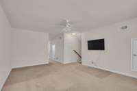 Large bonus living area at the top of stairs with full bathroom.  Perfect set up for in-law suite or teen suite upstairs.  Lots of floored attic storage.