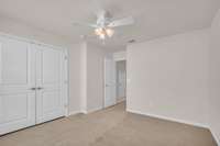 Light filled secondary bedroom on the second level with full bathroom next door.