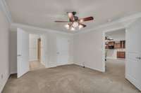 Primary suite is located on the main level with large private bath and walk-in closet.