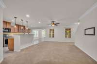 Spacious great room with recessed lighting.