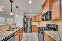 All appliances remain...stainless steal refrigerator has 2 ice makers, gas range with grill plate.