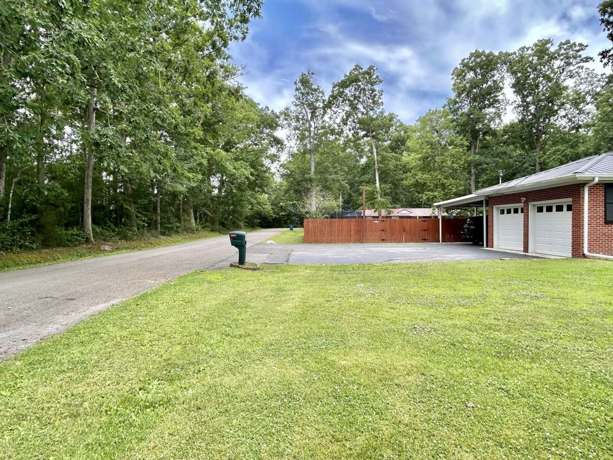 Great yard, front and back!! Corner lot with lots of mature trees!!