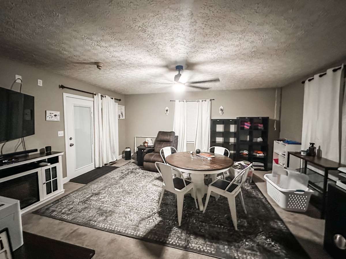 The large bedroom / bonus room upstairs is currently being used as an office.  This room features a large walk in closet, a full bath, and the door leads to a large wrap around deck that overlooks the swimming pool!!