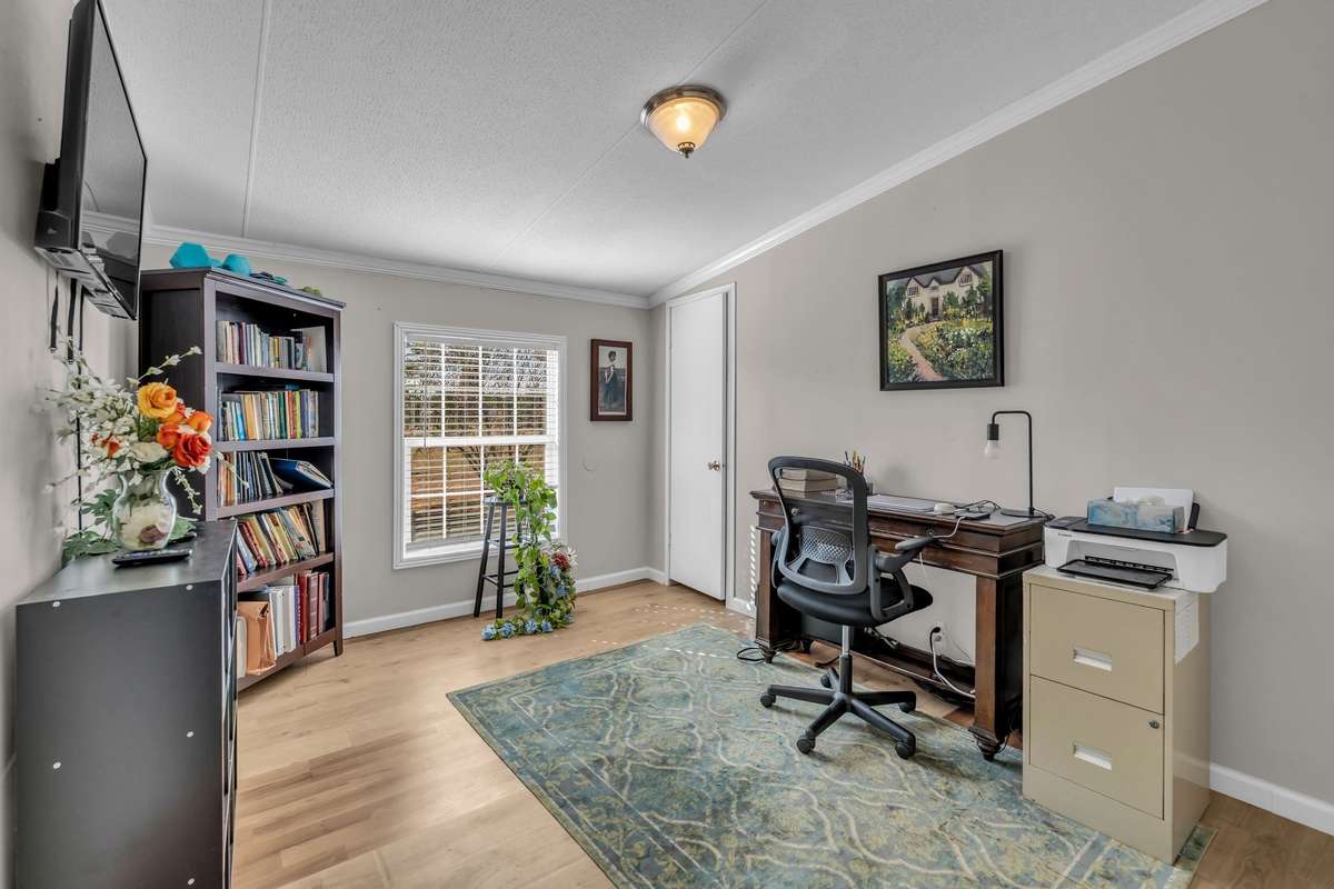 The space typically used as a second bedroom functions as an office