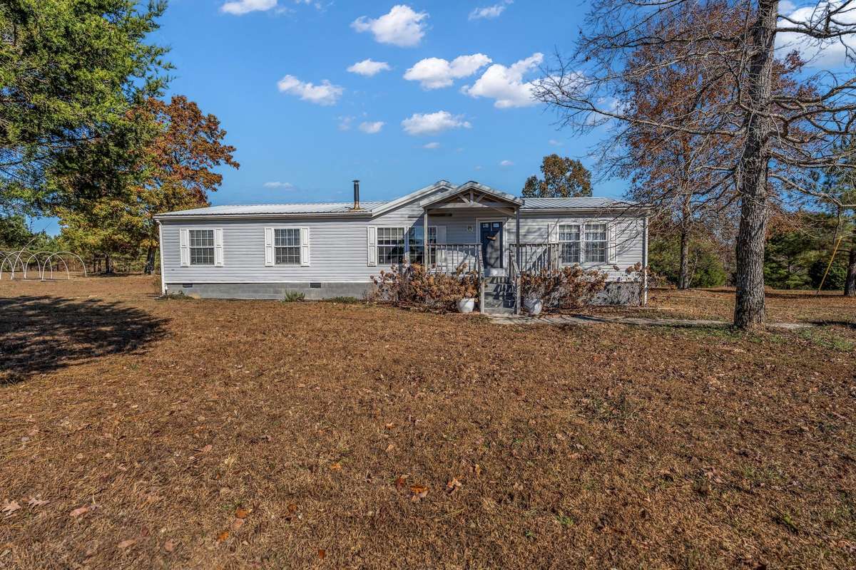 Offered in pristine condition, this charming home is nestled within peaceful, private surroundings