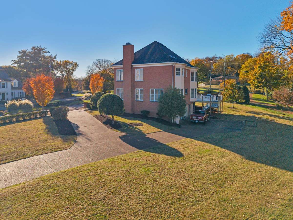 A circular driveway allows for easy access to the rear-entry garage while providing additional off-street parking.