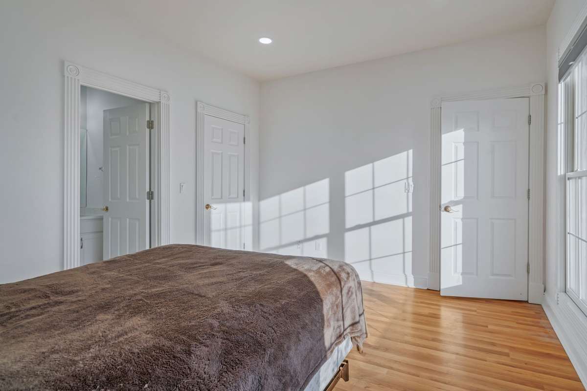 The middle door in this photo is access to a walk-in closet.