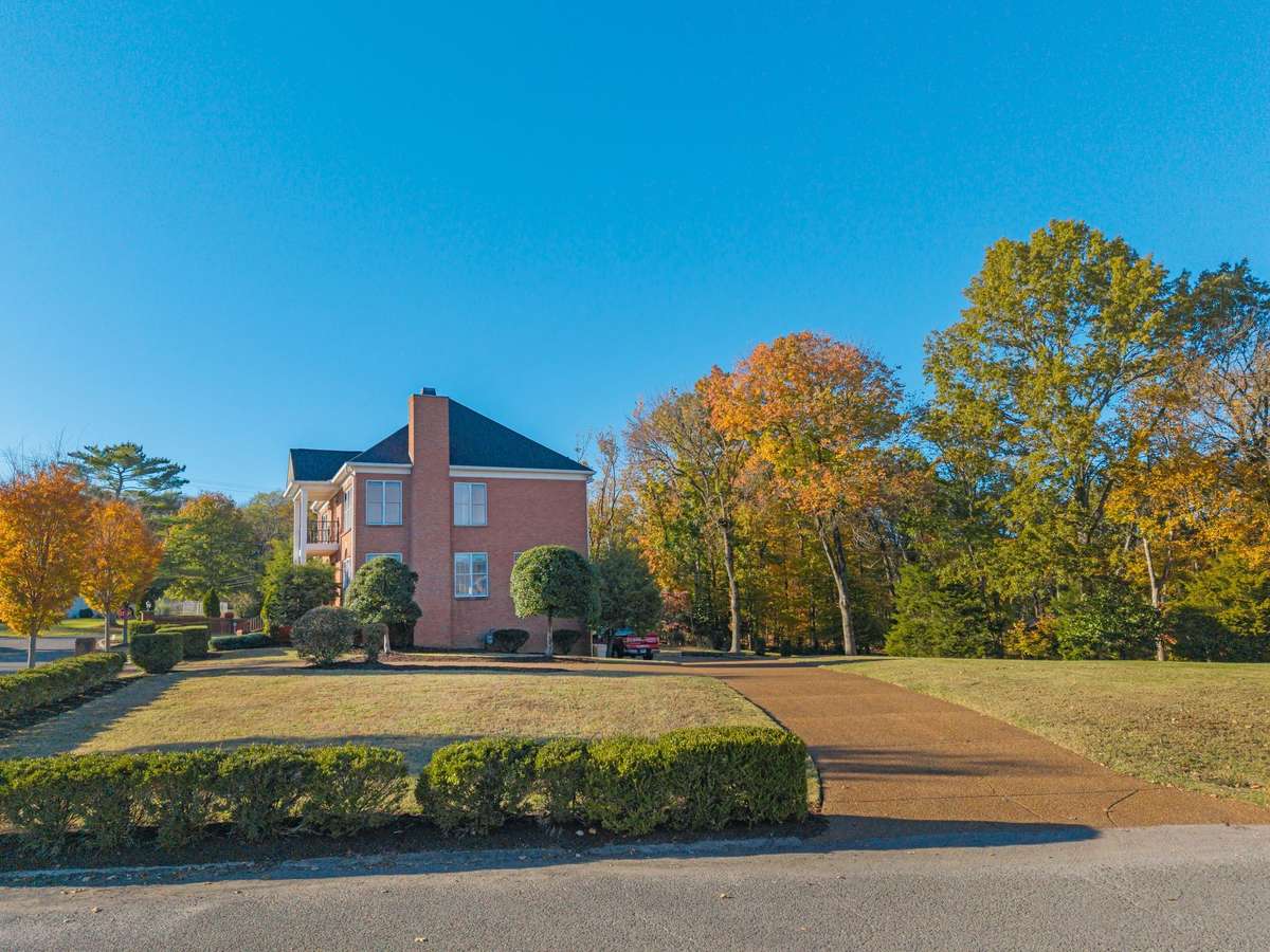 Here is a broader photo of the right side of the property and driveway access.